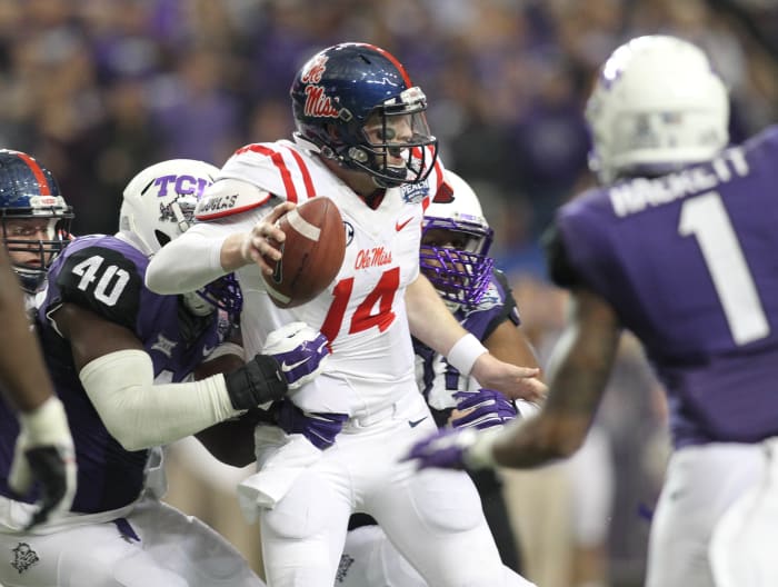Dec 31, 2014; Atlanta , GA, USA; TCU Horned Frogs defensive end James McFarland (40) sacks Mississippi Rebels quarterback Bo Wallace (14) in the third quarter in the 2014 Peach Bowl at the Georgia Dome. Mandatory Credit: Brett Davis-USA TODAY Sports